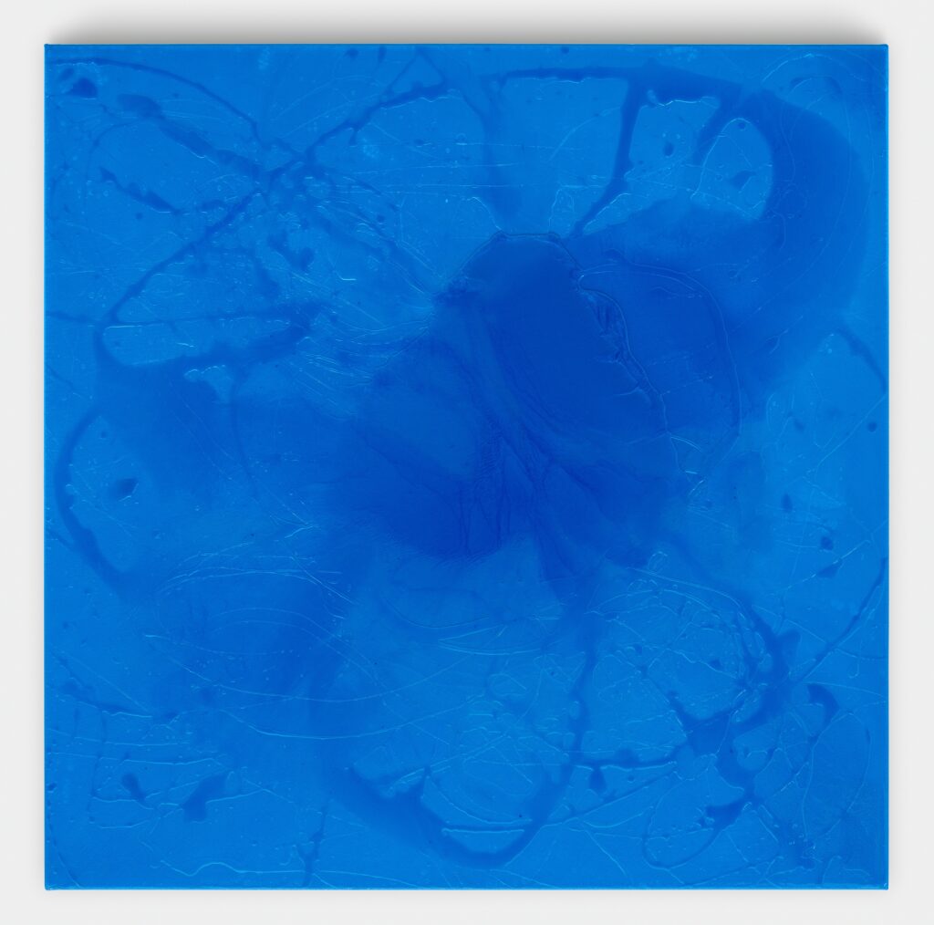 Abstract blue painting with textured patterns and shapes.